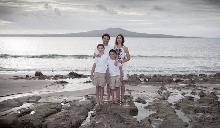 Family portrait at Castor Bay beach - Auckland
